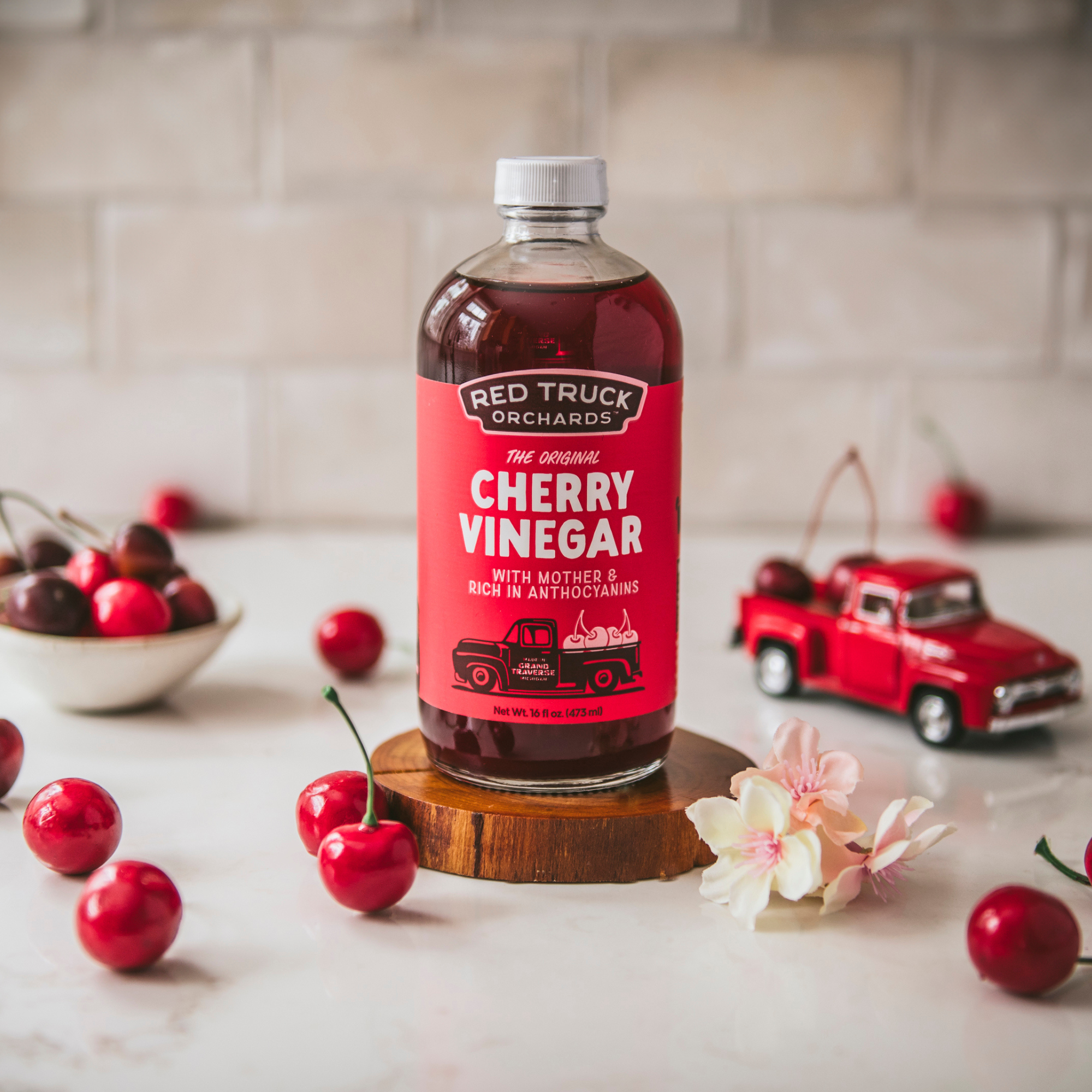 The Original Cherry Vinegar, by Red Truck Orchards, shown in our 16 ounce glass bottle.